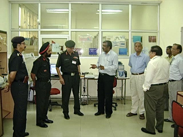Dr Saeed Ahmad Founder Director of Dot n Line with Dr P K Seth (CEO Biotech Park) and Army Delegates at Dr Saeed's Laboratory